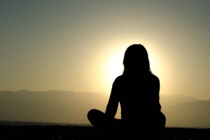 woman sitting on sand